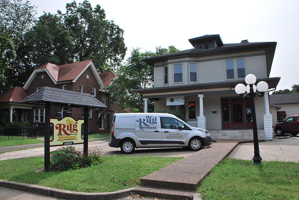 the-rug-merchant-business-location-1019-Lincoln-ave-evansville-indiana Excellent living room with decorative rug, furniture and a fireplace